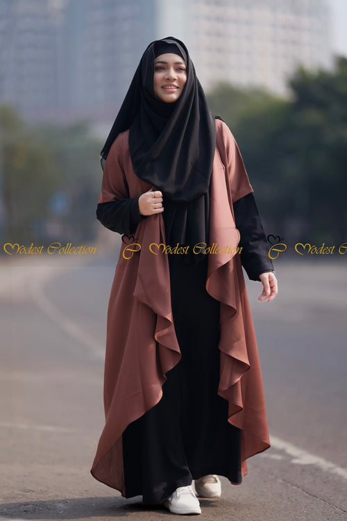 Woman wearing brown breathable fabric abaya with elegant modest fashion styling