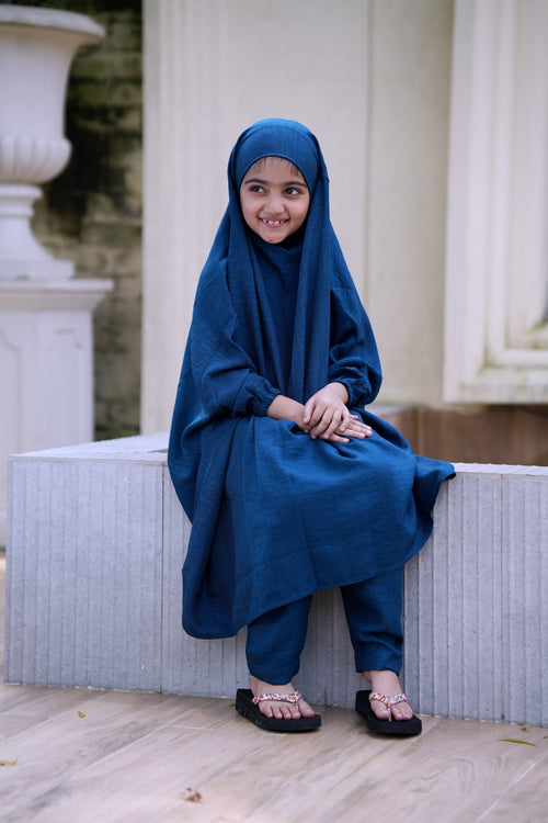 Matching mother and daughter teal color Ramie Cotton Jilbab sets for Umrah, showing a woman and a baby girl in identical full-coverage modest outfits with integrated head covers.