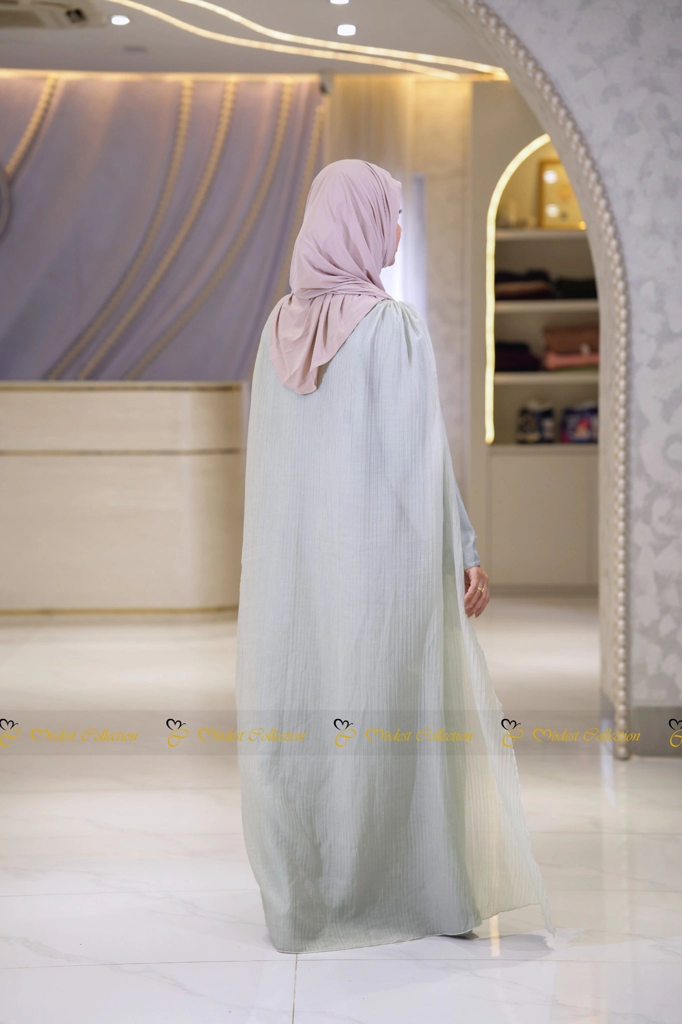 Premium modest Elsa inspired dress with textured fabric and flowing drape