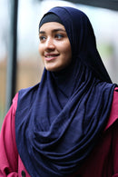 Woman wearing instant hijab with abaya, full coverage modest look for Hajj and Umrah