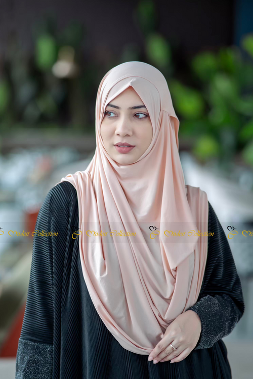Woman wearing jersey hijab with elegant modest fashion styling