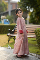 Girl wearing Little Meadow Abaya sitting next to her mother in matching Meadow Abaya.