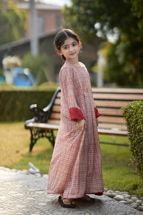 Girl wearing Little Meadow Abaya sitting next to her mother in matching Meadow Abaya.