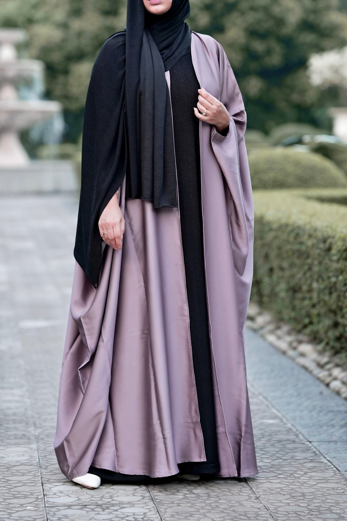 Luxurious 3-piece Dubai abaya set featuring a taupe Orchid Silk cape shrug and glisten black jersey inner