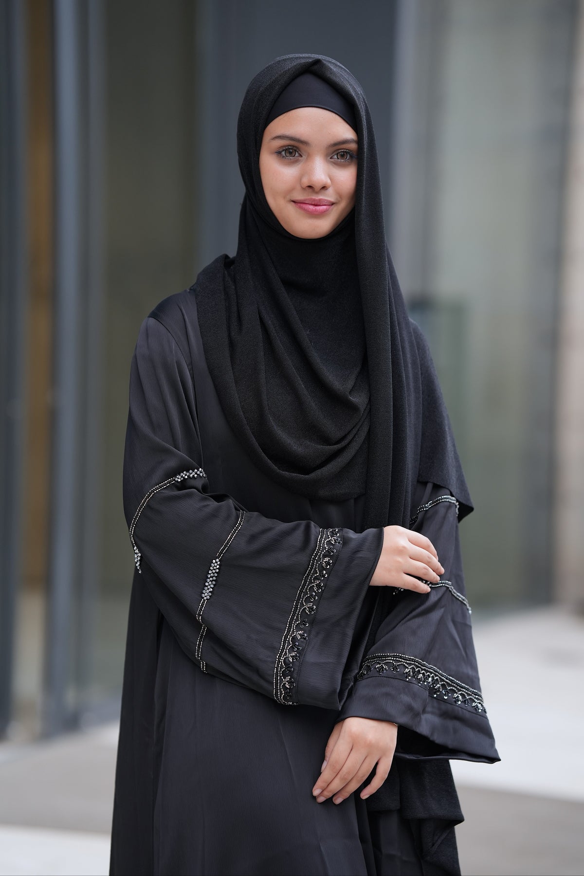 Soft, smooth, and luxurious saffron fabric texture of the custom-ordered Andalus Abaya by Modest Collection, designed for timeless elegance and special occasions.