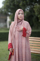 Close-up of the inverted front pleats and textured fabric of the Meadow Abaya.