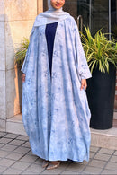 full view of the lightweight, summer-friendly georgette fabric and floral print of the Ocean Shrug