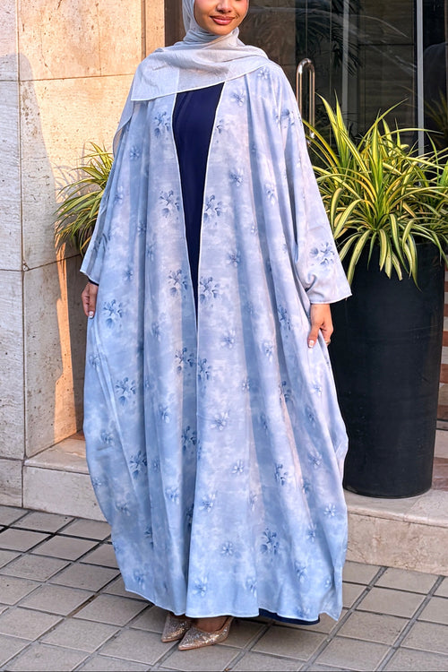 full view of the lightweight, summer-friendly georgette fabric and floral print of the Ocean Shrug