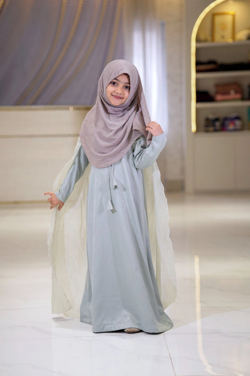 Little girl wearing Elsa inspired mom daughter matching modest dress with flowing cape sleeves in icy blue