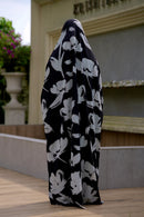 Black full-length printed jilbab featuring an attached niqab and breathable non-transparent georgette fabric for summer comfort.