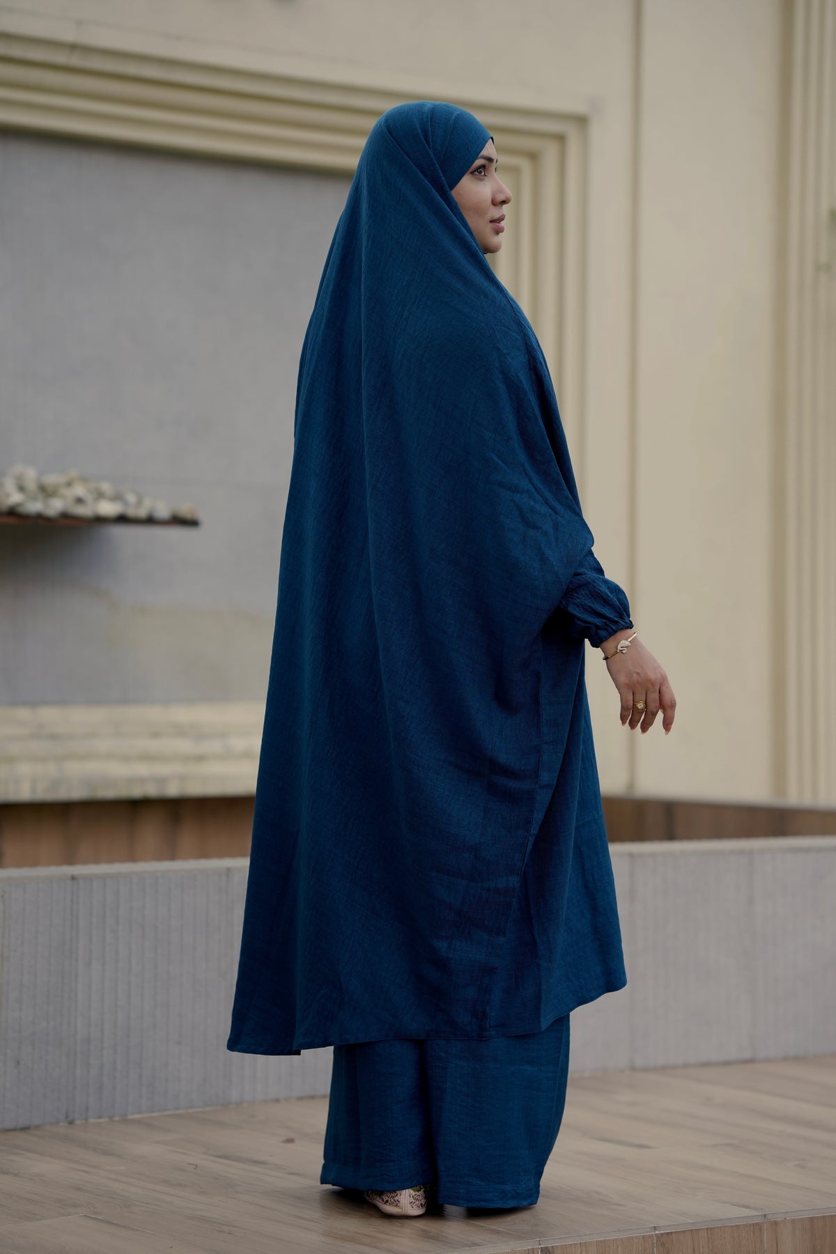 Side view of a premium teal color Ramie Cotton Jilbab set designed for Umrah and daily modest fashion, showing full-length fluid coverage and sleeve cuff details.