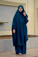 Front view of a full-coverage teal color Ramie Cotton Jilbab for Umrah and modest wear, featuring integrated head cover and matching wide-leg trousers.