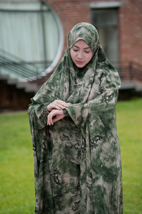  Close-up of the hidden side pocket and smocked elastic wrist cuff on the Sage Smoke Georgette Khimar.