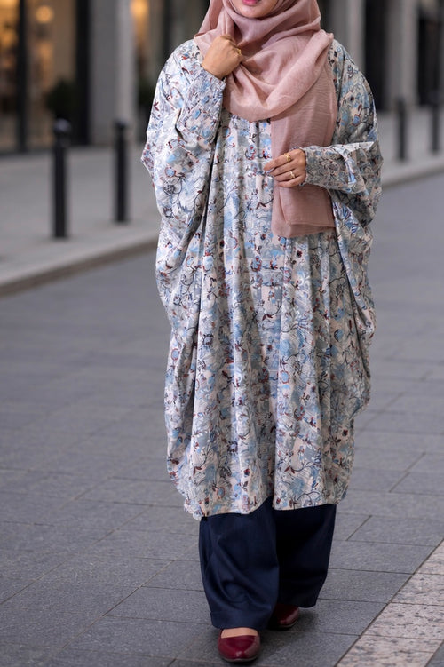 Front view of the Tanaka Top in Azure featuring a round neck, pullover silhouette, and smocked sleeves.