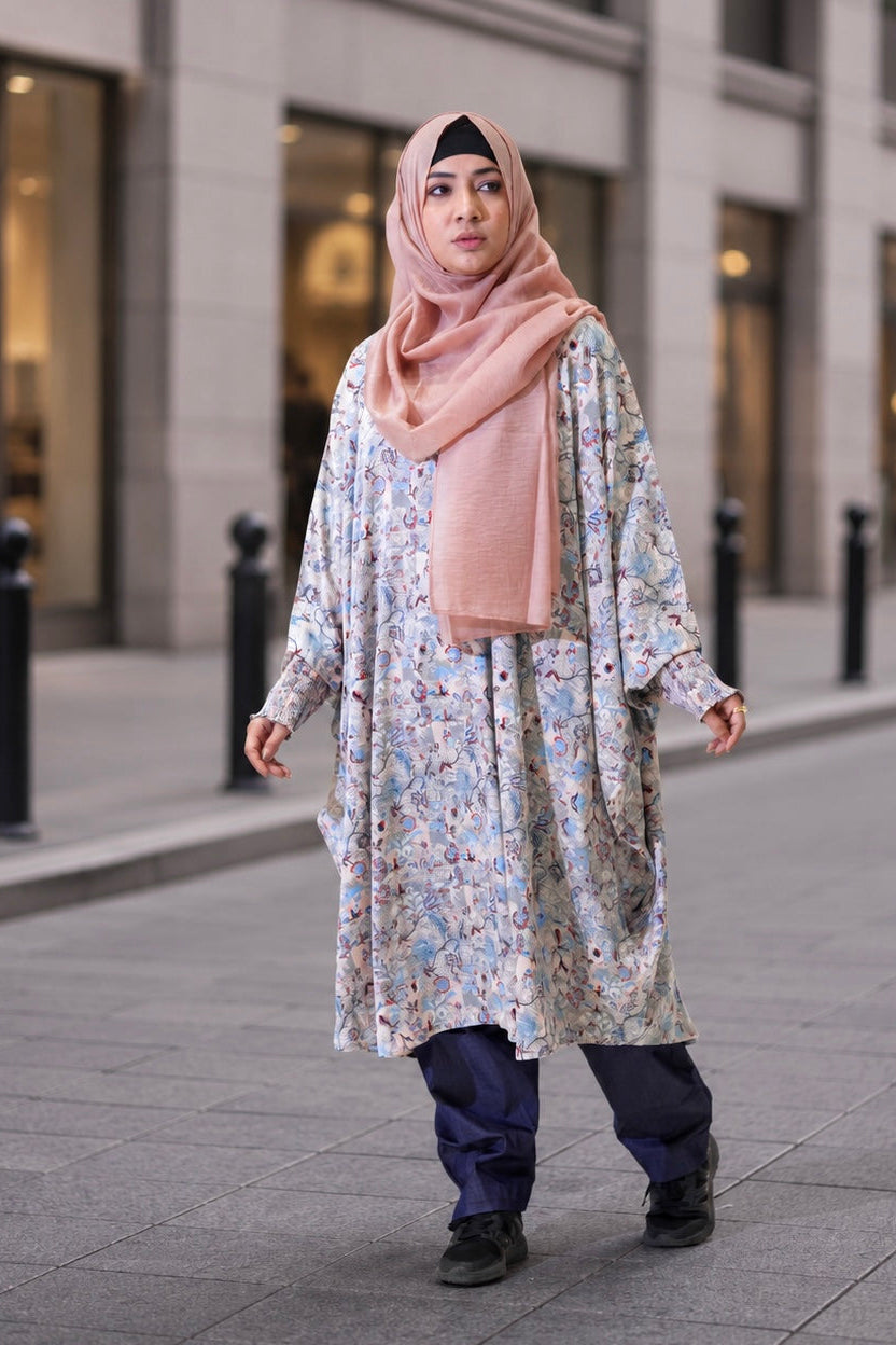 The Tanaka Top in Azure styled with slim-fit denim trousers for a polished, everyday urban look.