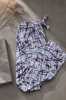 White printed slim-fit linen trousers with an elasticized waist, tailored for a polished summer look.